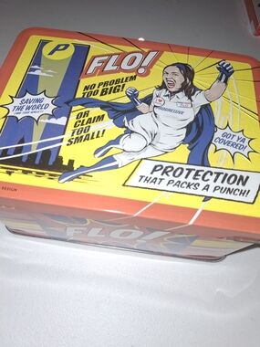 FLO! Comic-Style Tin with Bright Yellow & Coral Artwork